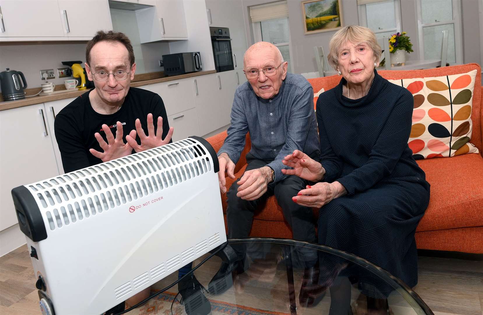 Cold comfort . . . Jonathan Howe with second floor neighbours, Margaret and Ron Haddock Picture by Mecha Morton