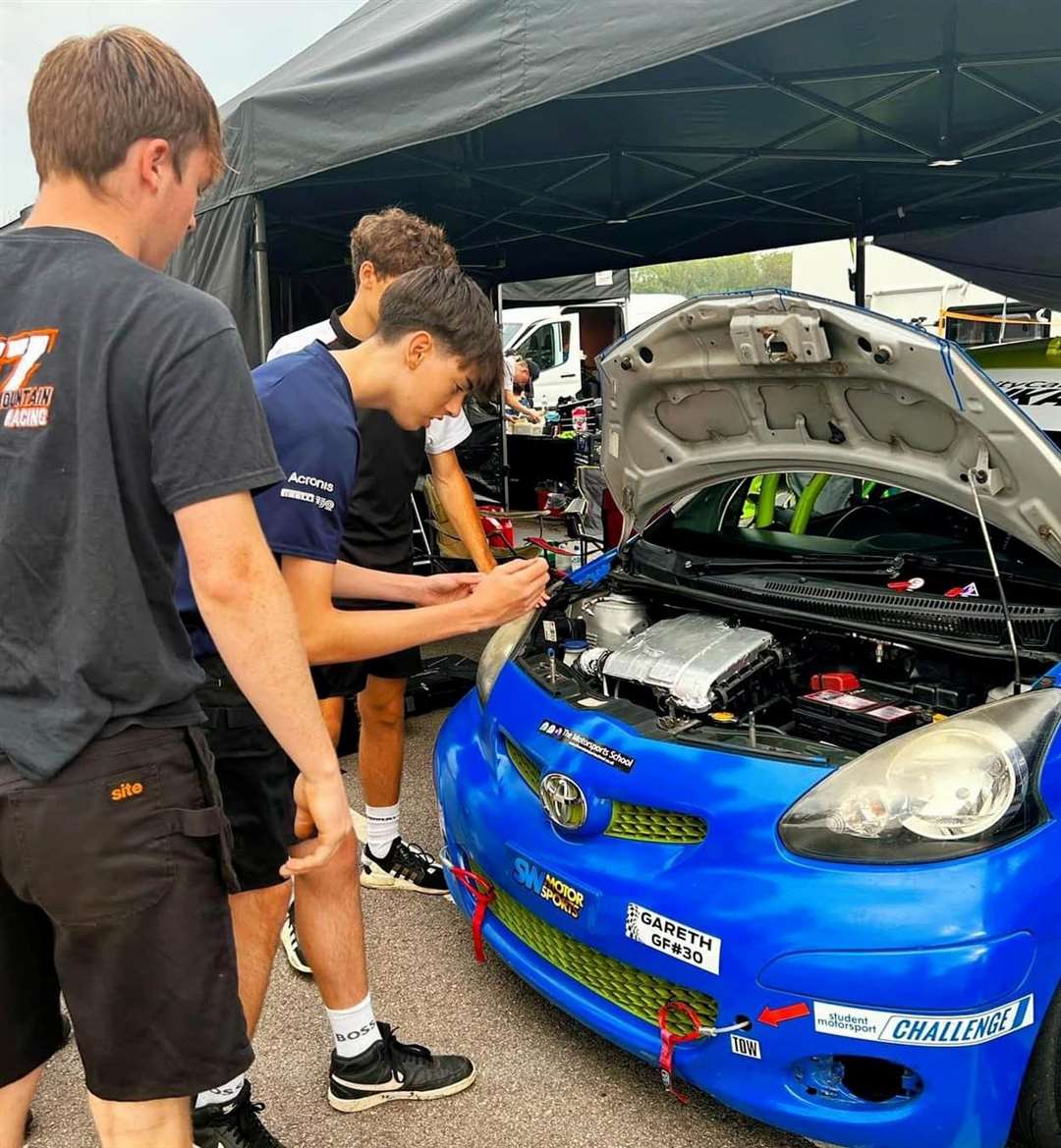 The motorsport engineering students from West Suffolk College working on the race car at Donington Park Circuit. Picture: Cat Haken