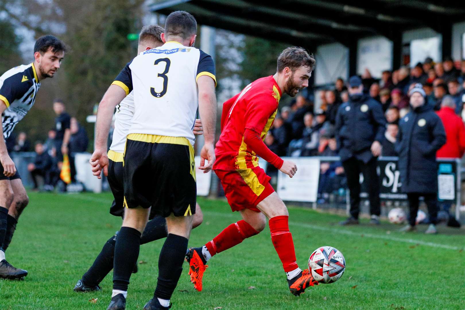 Scott Chaplin tries to play Walsham through against Harleston Picture: Mark Bullimore