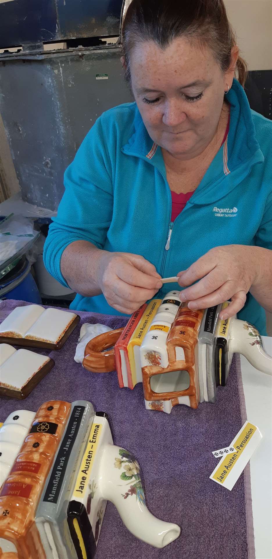 Tracey Maskell adding printed details to a teapot