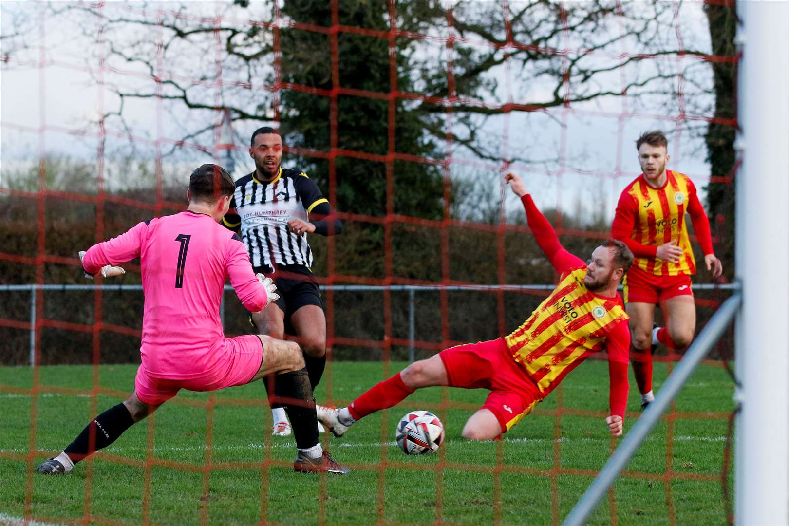 Sam Nunn slides in against Harleston Town Picture: Mark Bullimore