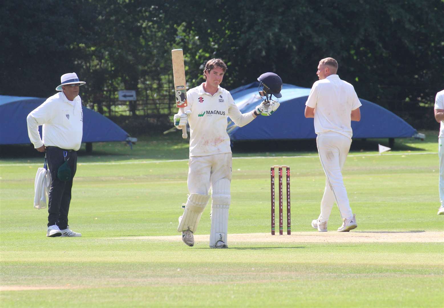 Suffolk’s Josh Cantrell celebrates scoring his maiden century for the county versus Buckinghamshire at Copdock. Picture: Nick Garnham