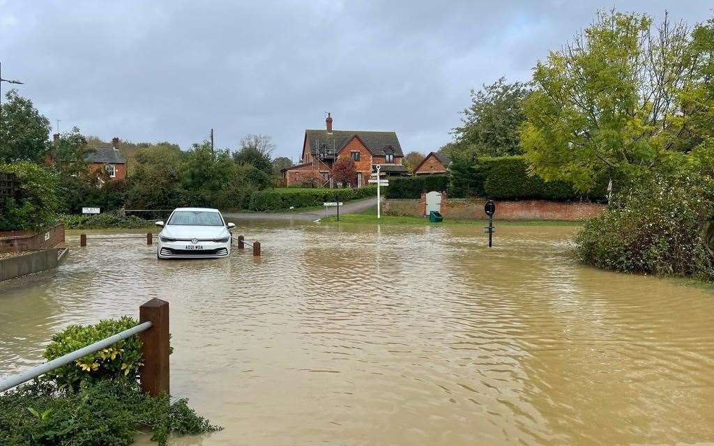 A car stranded amidst the flooding in Debenham. Picture: Derry Hart